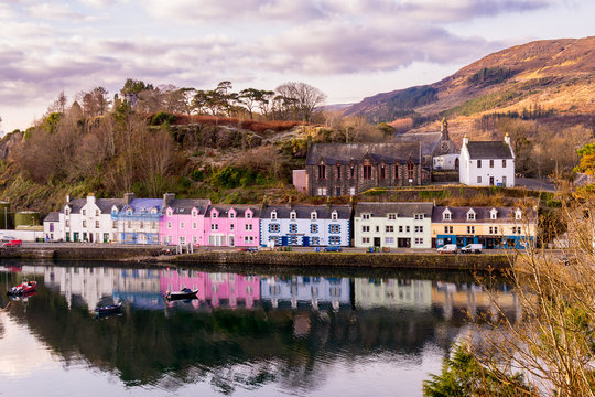 Reflections of Coloured houses in harbour, Portree, Scotland