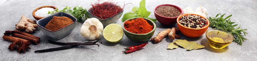 Spices and herbs on table. Food and cuisine ingredients. - obrazy, fototapety, plakaty