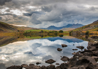 Reflections of Mount Snowdon and clouds in Llynnau (Lake) Mymbyr , Snowdonia National Park, Wales, UK