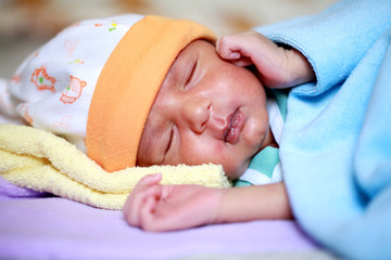 Close-up portrait of a sleeping newborn baby 