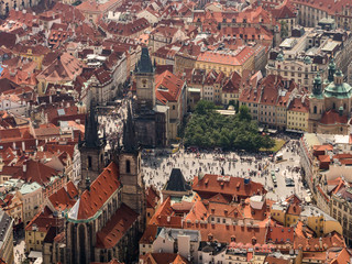 Obraz premium Aerial view on Prague City, Czech Republic. Panoramic view from airplane. Aerial view of Prague. The red roofs of Prague.