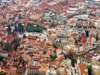 Foto op Canvas Aerial view on Prague City, Czech Republic. Tynsky temple. Panoramic view from airplane. Aerial view of Prague. The red roofs of Prague. © murmakova