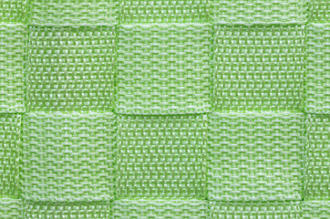 Green knitting rope is the background.