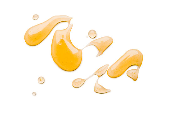 Liquid honey isolated on white background