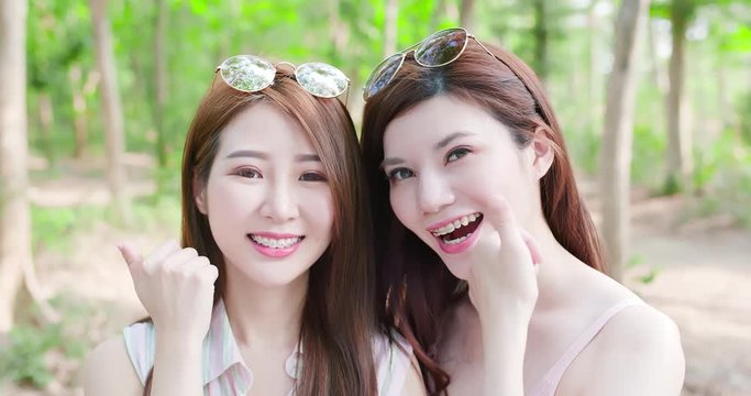 two beauty women smile happily