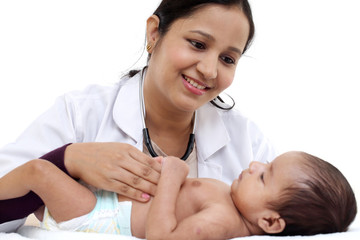 Newborn baby examination by doctor woman - 205914010