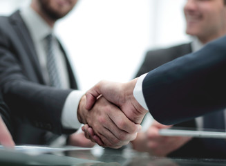 Close-up image of a firm handshake