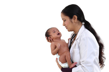 Newborn baby examination by doctor woman - 205914041