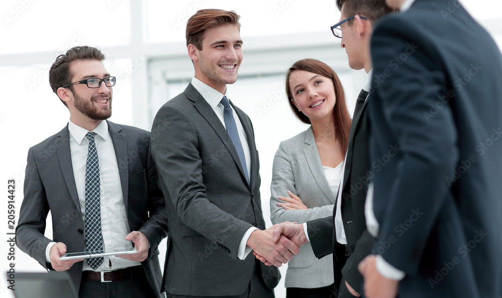 Wall mural colleagues shaking hands in office