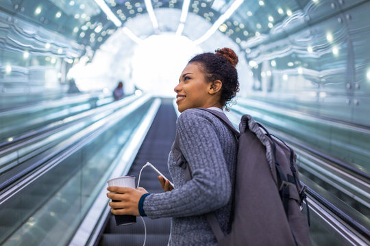 Young Woman On Subway Escalator
