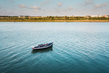 View of a moroccan small boat floating on a river