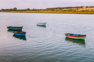 Fototapeta na wymiar View of moroccan small boats floating on water