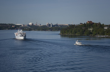 Obraz premium Ferrys arriving to Stockholm from the archipelago