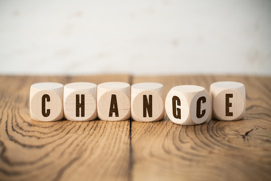 Cubes with letters where one of them has two letters showing the words "change" and "chance" at the same time 