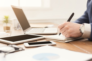 Fototapeta premium Unrecognizable businessman typing on laptop