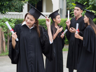 Graduation Friend Achievement Celebrate Degree Concept.Beautiful Asian university graduates celebrate their success.