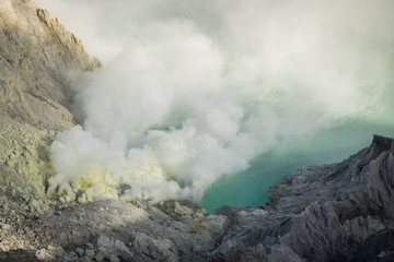 Fototapeta na wymiar The sulfur smoke's eruptions. Kawah Ijen at Indonesia.