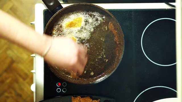 Nuggets. The process of frying in a frying pan. Dipping into boiling oil.