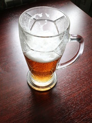 a glass of beer on the table