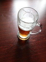 a glass of beer on the table