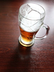 a glass of beer on the table