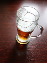 a glass of beer on the table