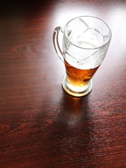a glass of beer on the table