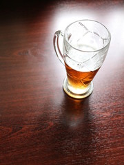a glass of beer on the table