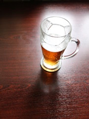 a glass of beer on the table