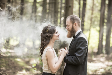portrait of the bride and groom on the background of the Park