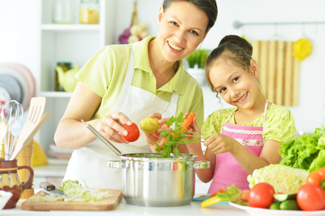 mom and daughter on kitchen