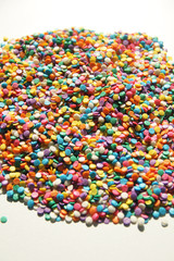 Colorful candy sprinkles isolated on white background 