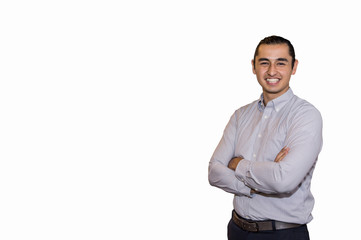 Handsome young man in casual wear keeping arms crossed and smiling while standing isolated on white background