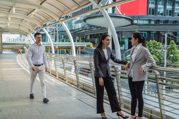 Young businessmen meeting outside the business district.