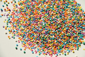 Colorful candy sprinkles isolated on white background 