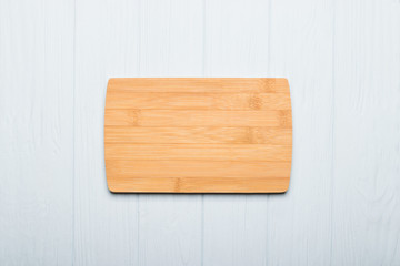Spice herbs and vegetables frame food background and empty cutting board