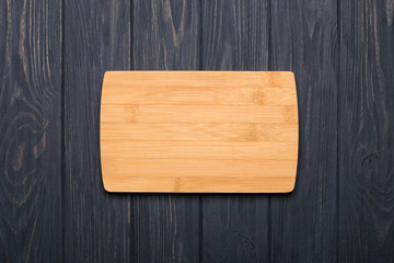 Spice herbs and vegetables frame food background and empty cutting board