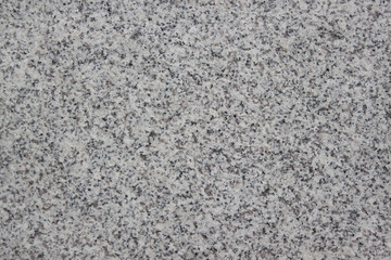 Gray grainy texture with marble chips. Used as a background.
