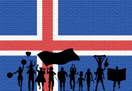 Icelander supporter silhouette in front of brick wall with Iceland flag