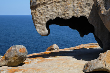 sky and mountain rock on the ocean