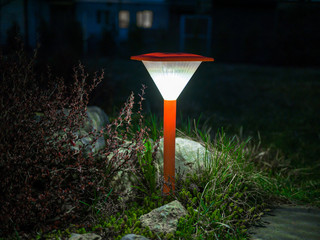 Decorative small red solar garden lantern. solar powered lamp