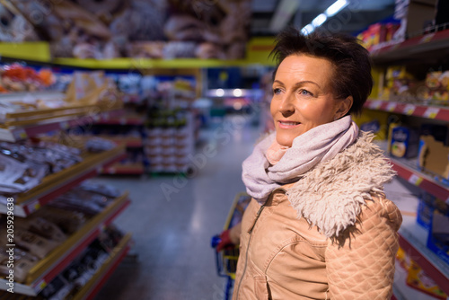 Mature woman at the grocery store Mature woman at the grocery store