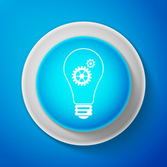 White Light lamp icon isolated on blue background. Bulb with gears and cogs working together symbol. Idea concept. Circle blue button with white line. Vector Illustration