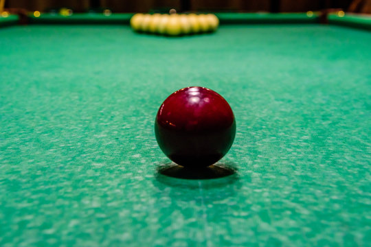 Red ball on the green cloth. Russian billiard