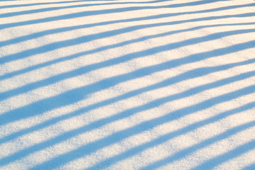 Shadows in the snow along the diagonal from edge to edge