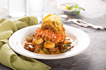 Grits with a lobster tail, shrimp and sausage