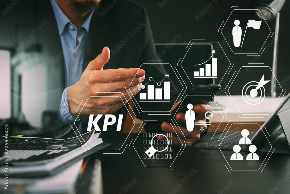Poster businessman working with smart phone and digital tablet and laptop computer in modern office
