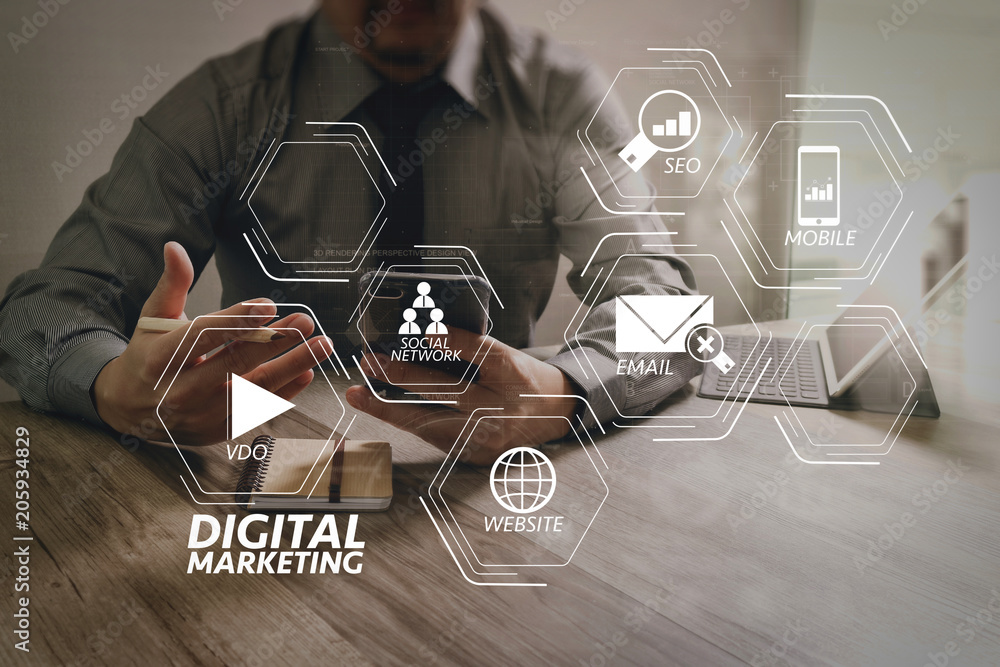Poster businessman using smart phone and keyboard dock digital tablet.Worldwide network connection technology interface.on marble desk,sun flare effect