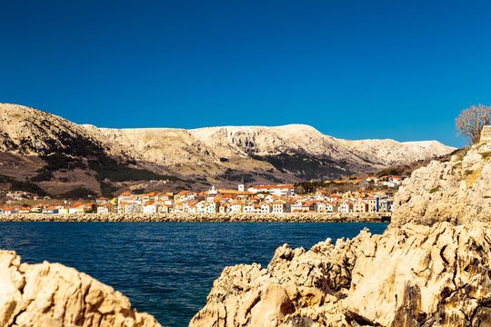 Baska and its beach in a sunny day, Krk Island, Dalmatia, Adriatic Coast, Croatia.