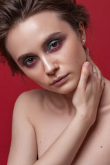 beauty portrait of young girl on red background